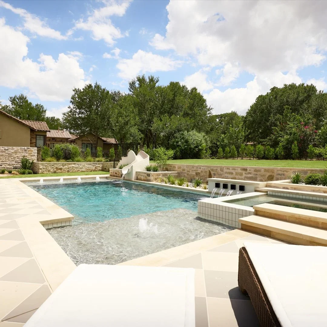 Pool overview with water slide and raised spa — Georgetown Texas