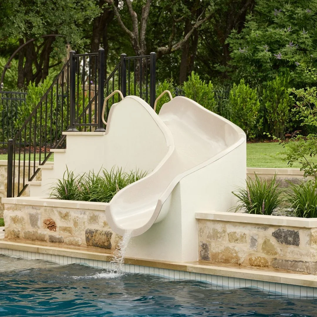 Water slide with limestone retaining wall — Georgetown TX pool