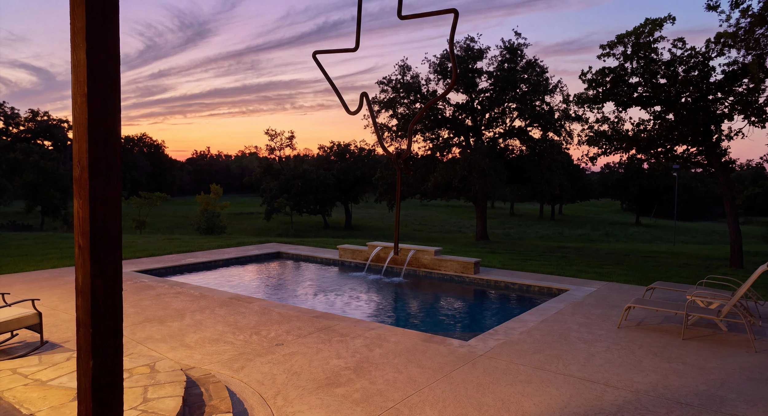 Custom gunite pool at twilight — Luckenbach residence, Kingsland, Texas