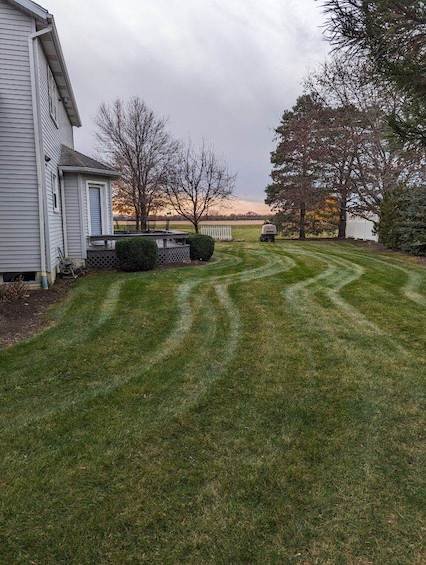 Precision mowing with perfectly striped lawn lines by Shoreline Yardworks