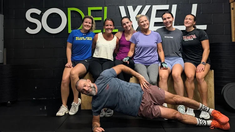 SoDel Well members smiling together in the studio