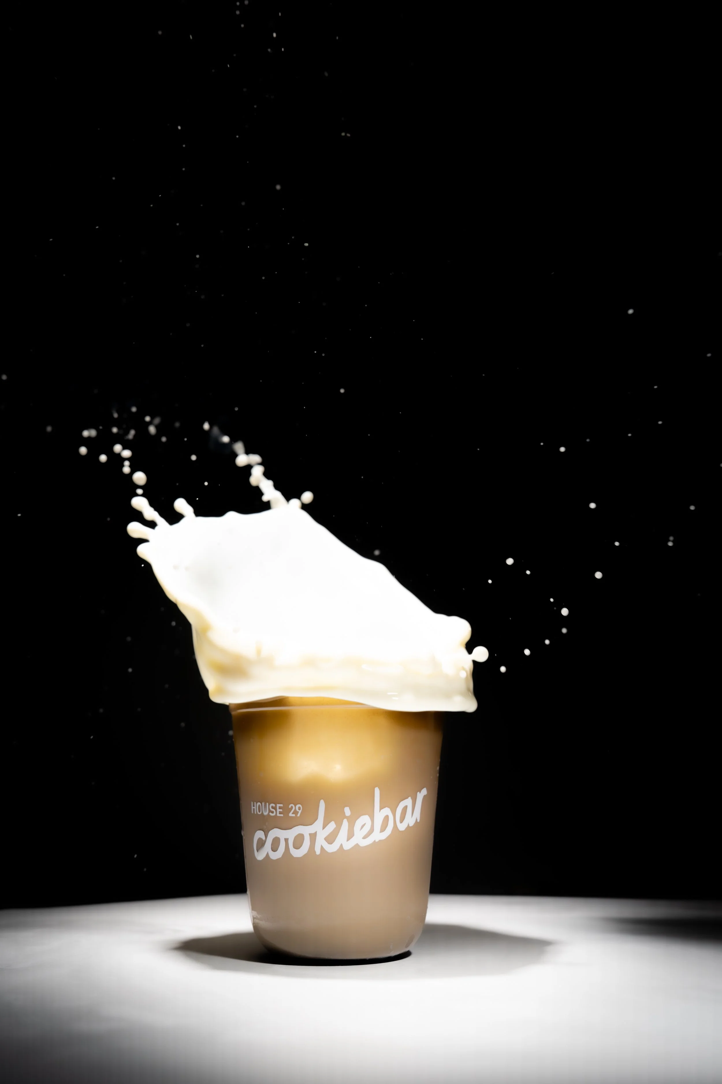 Milk splashing out of a coffee drink