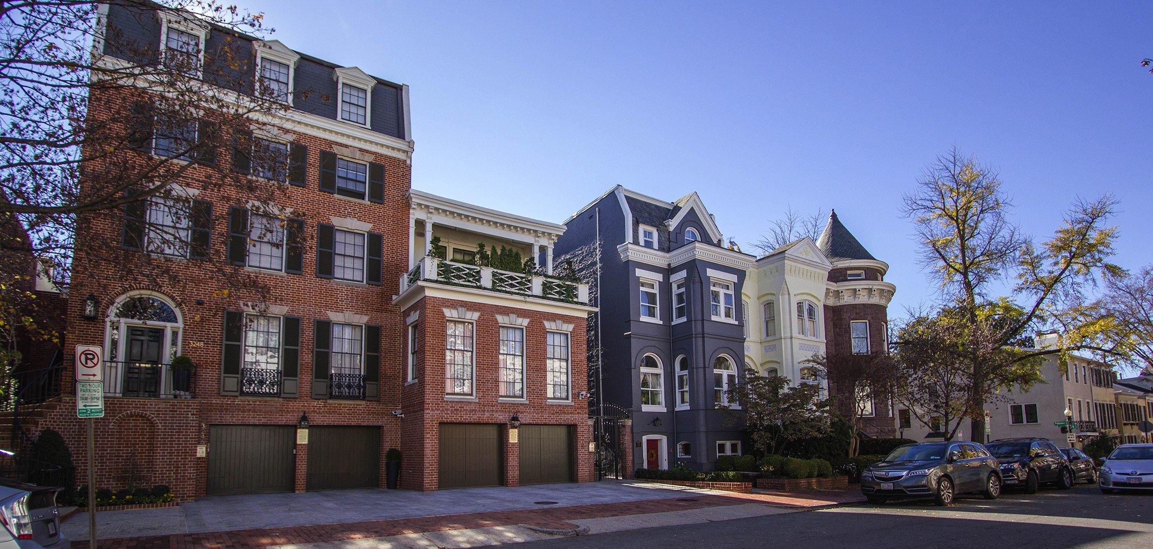 Brick and painted Victorian rowhouses on a residential street in Georgetown, Washington DC