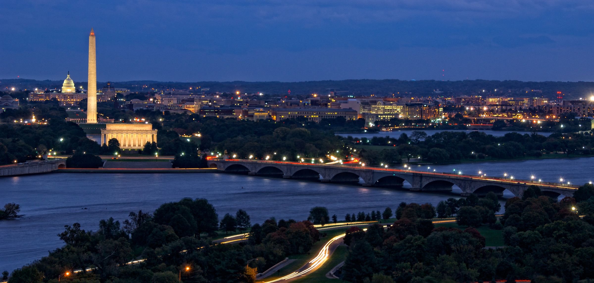 Washington DC skyline at dusk with the Washington Monument, Lincoln Memorial and Arlington Memorial Bridge over the Potomac River
