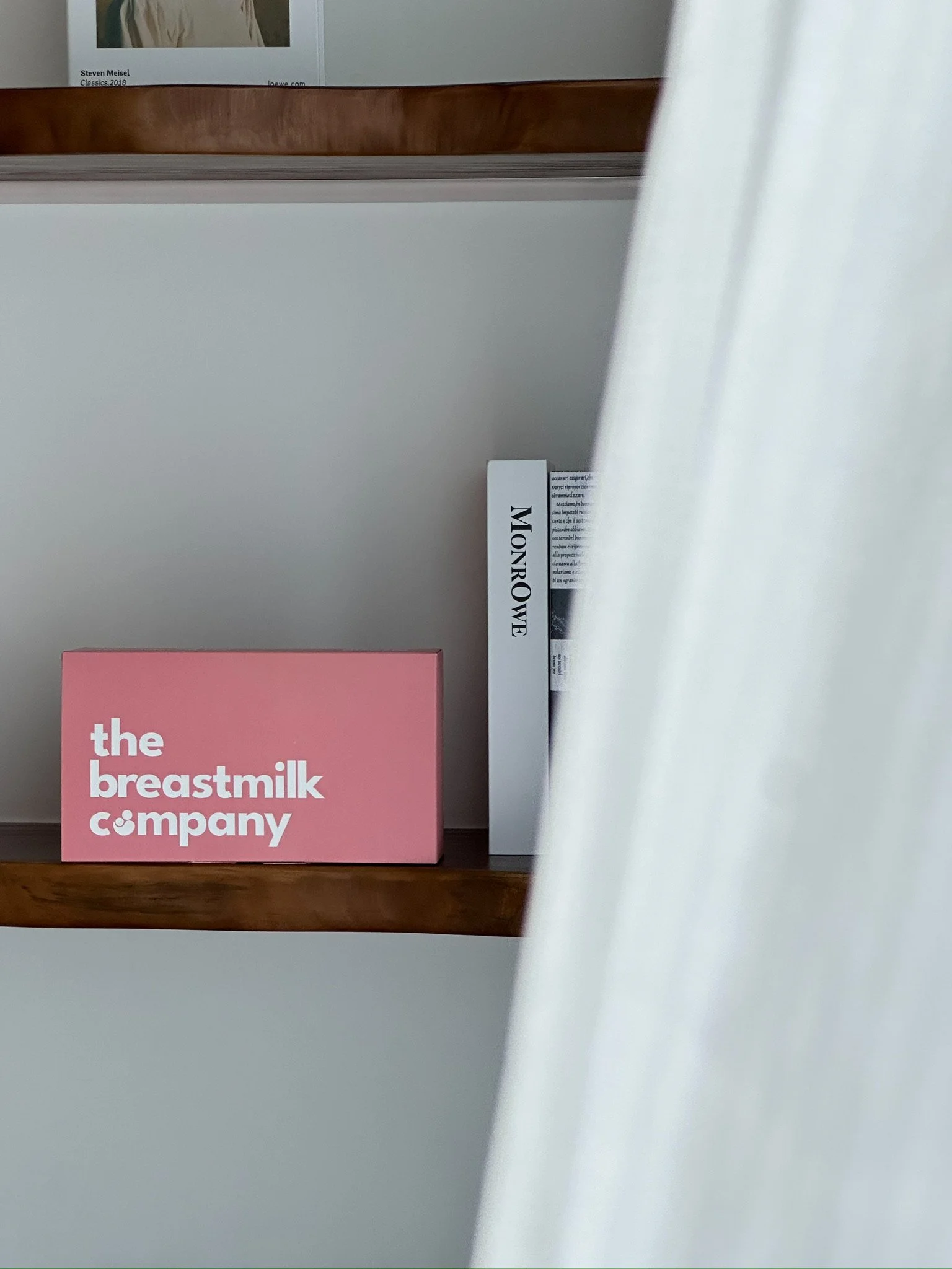 A mother cradling her newborn baby — warm and nurturing