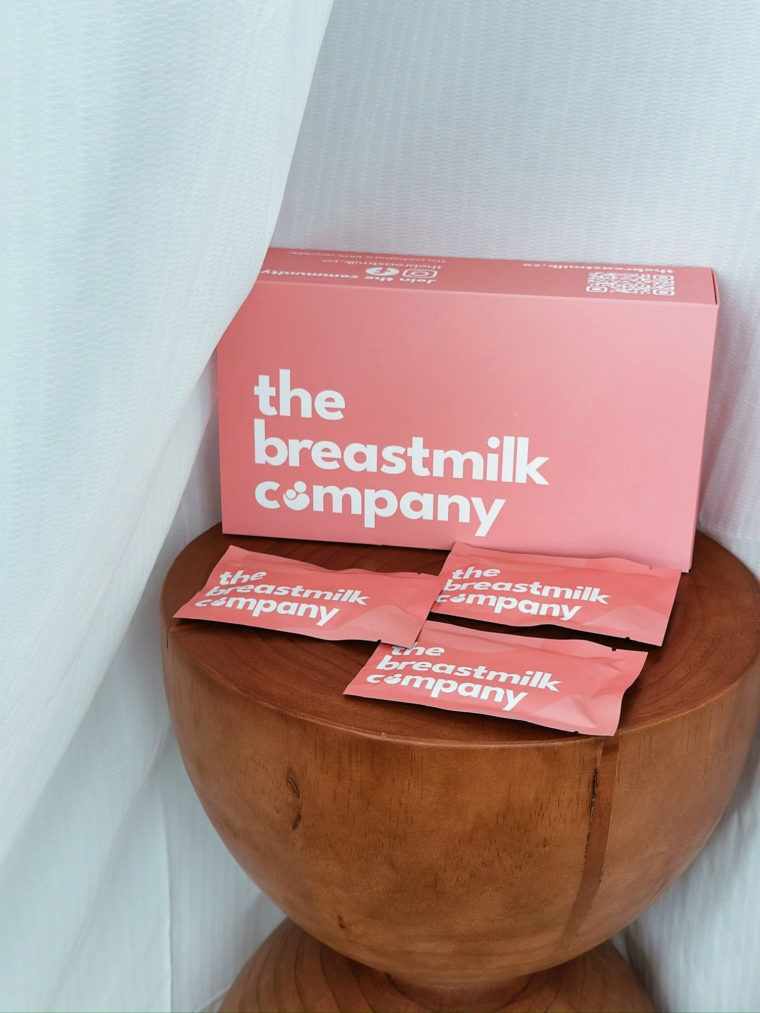 A mother holding her freeze dried breastmilk sachets, reassured and confident