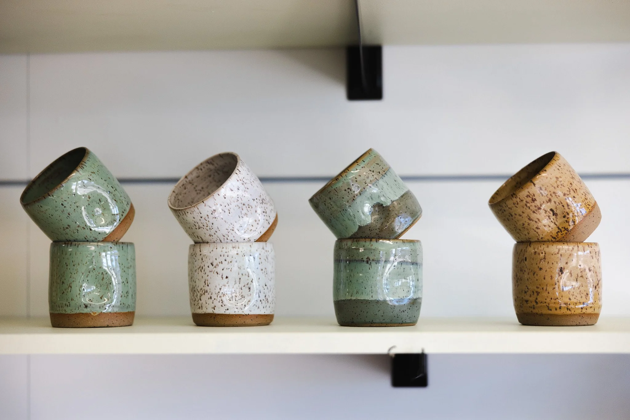 Pottery wheels and handmade cups inside the Floridian Ceramics studio in Tampa