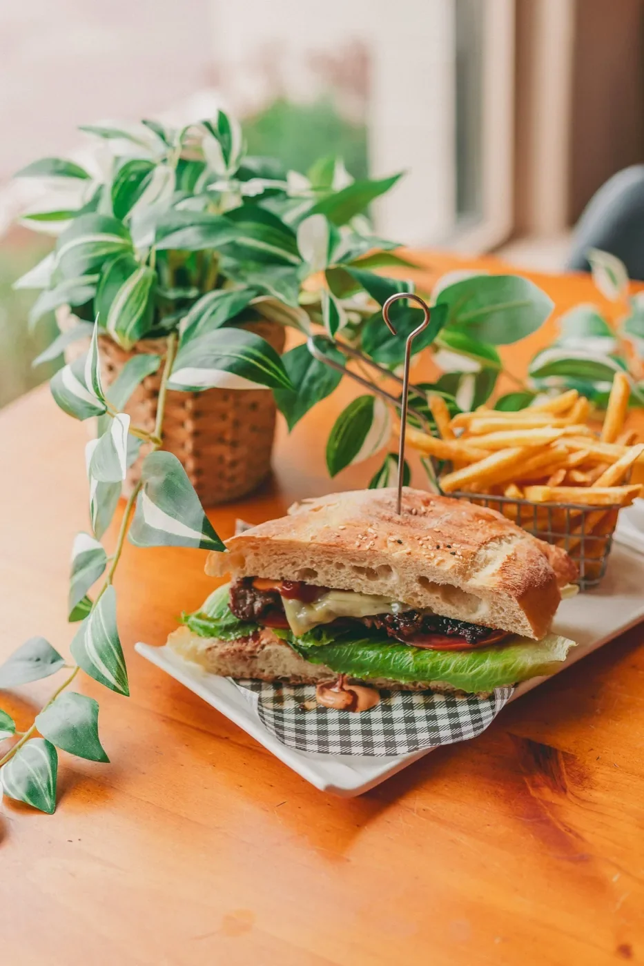House burger with fries by the window