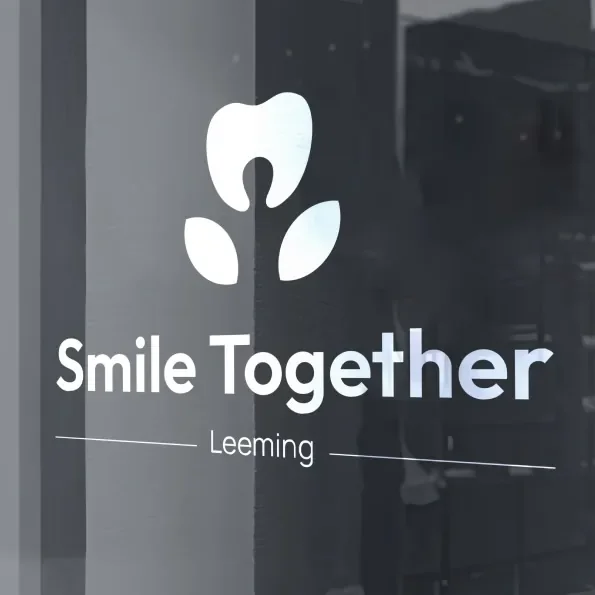Smile Together brand signage on frosted glass