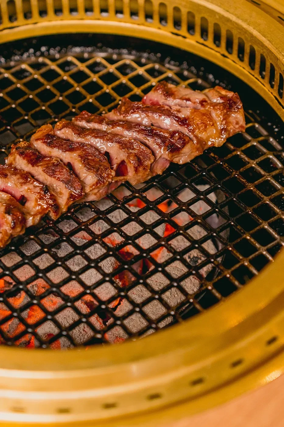 Wagyu grilling over binchotan coals