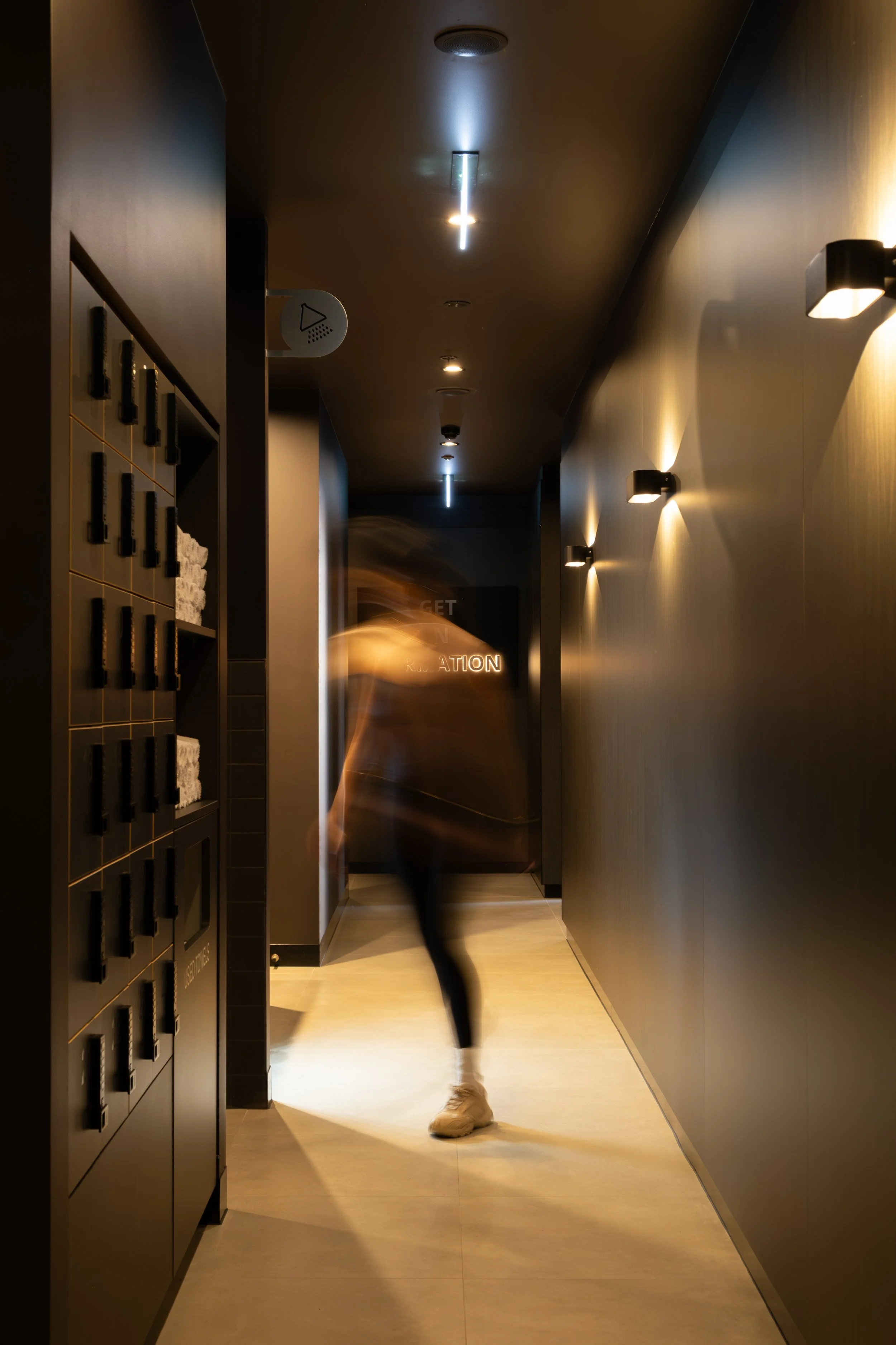 F2 Collective shower hallway with fresh towels