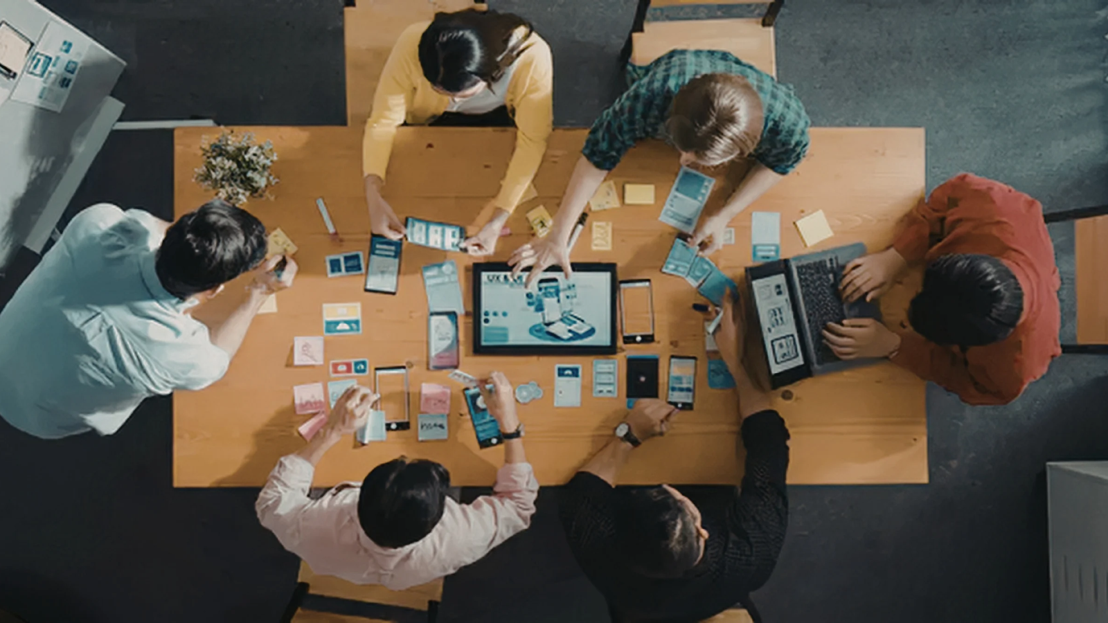 Small business team reviewing a marketing plan together at a table