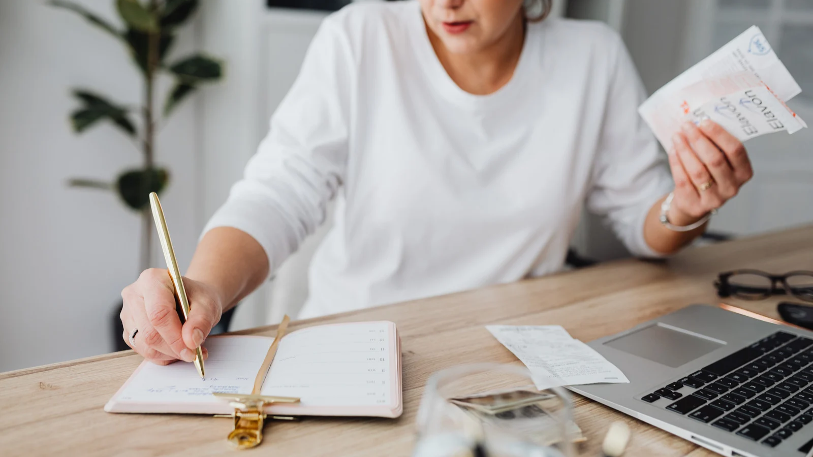 Small business owner working calmly at a desk while marketing runs in the background