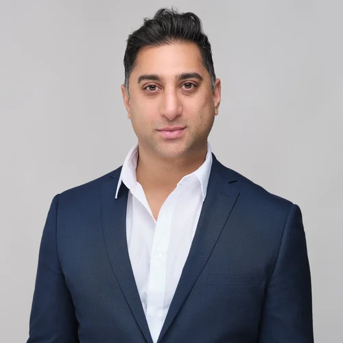 Headshot of a man in a navy blazer and open-collar shirt, ATX Headshots