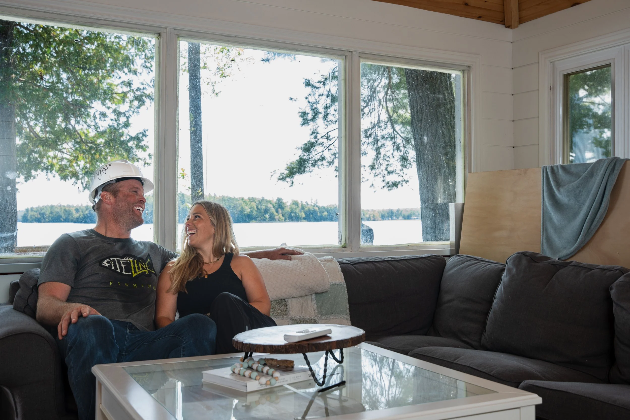 Documentary scene of volunteers assisting accessibility-centered rebuild.