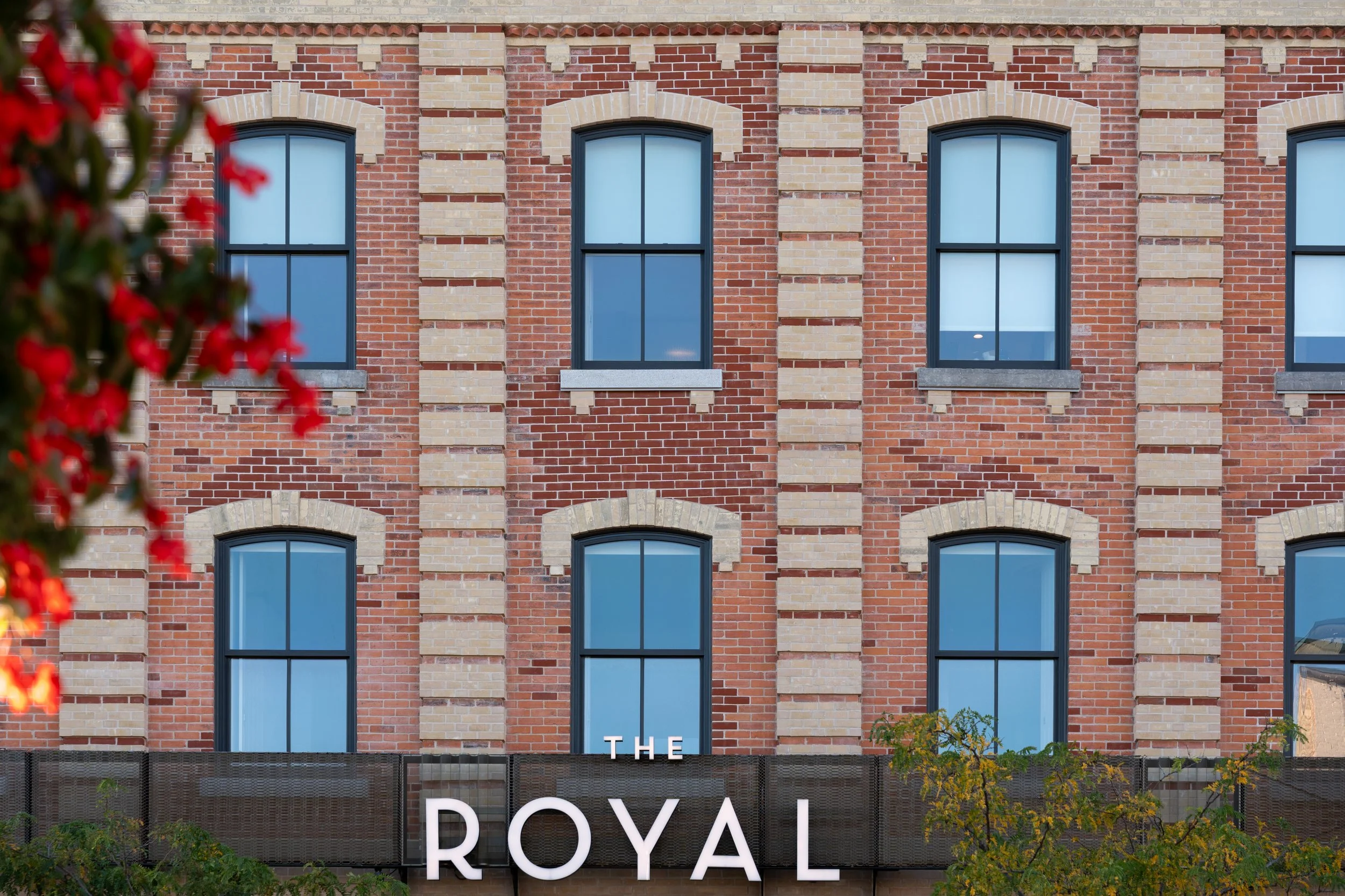 Candid image of Sorbara family members collaborating at their Prince Edward County property for Globe Content Studio.