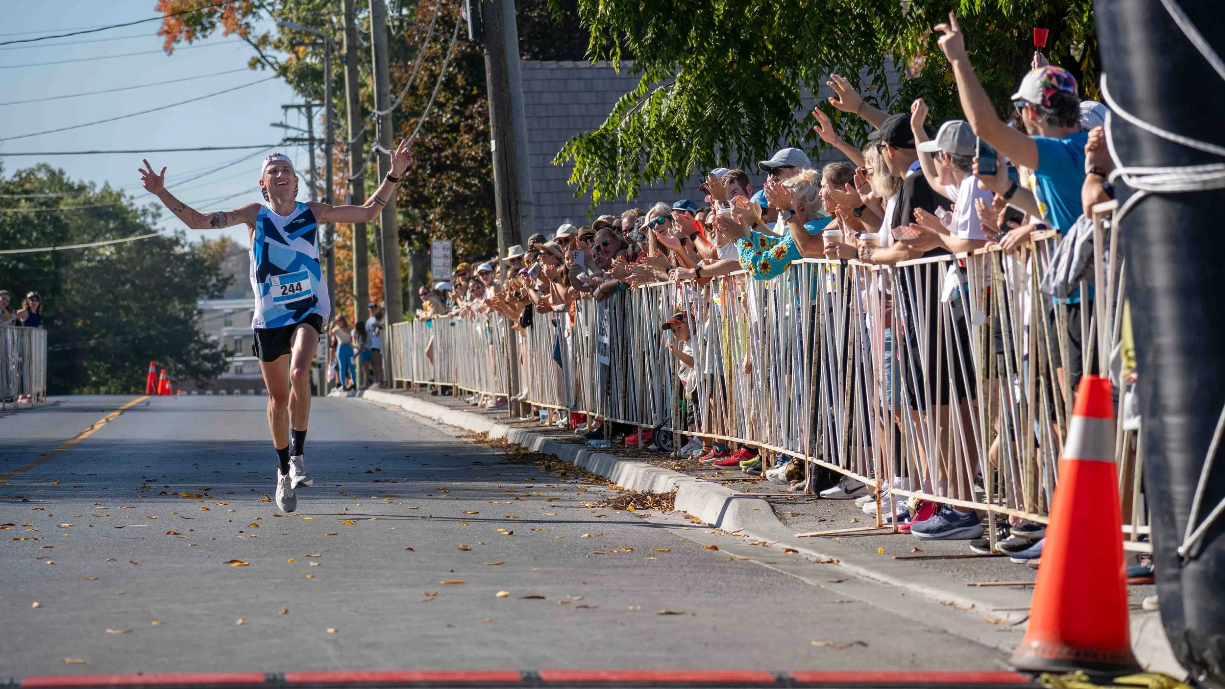 Spectators cheer runners along the route during the County Marathon in Prince Edward County.