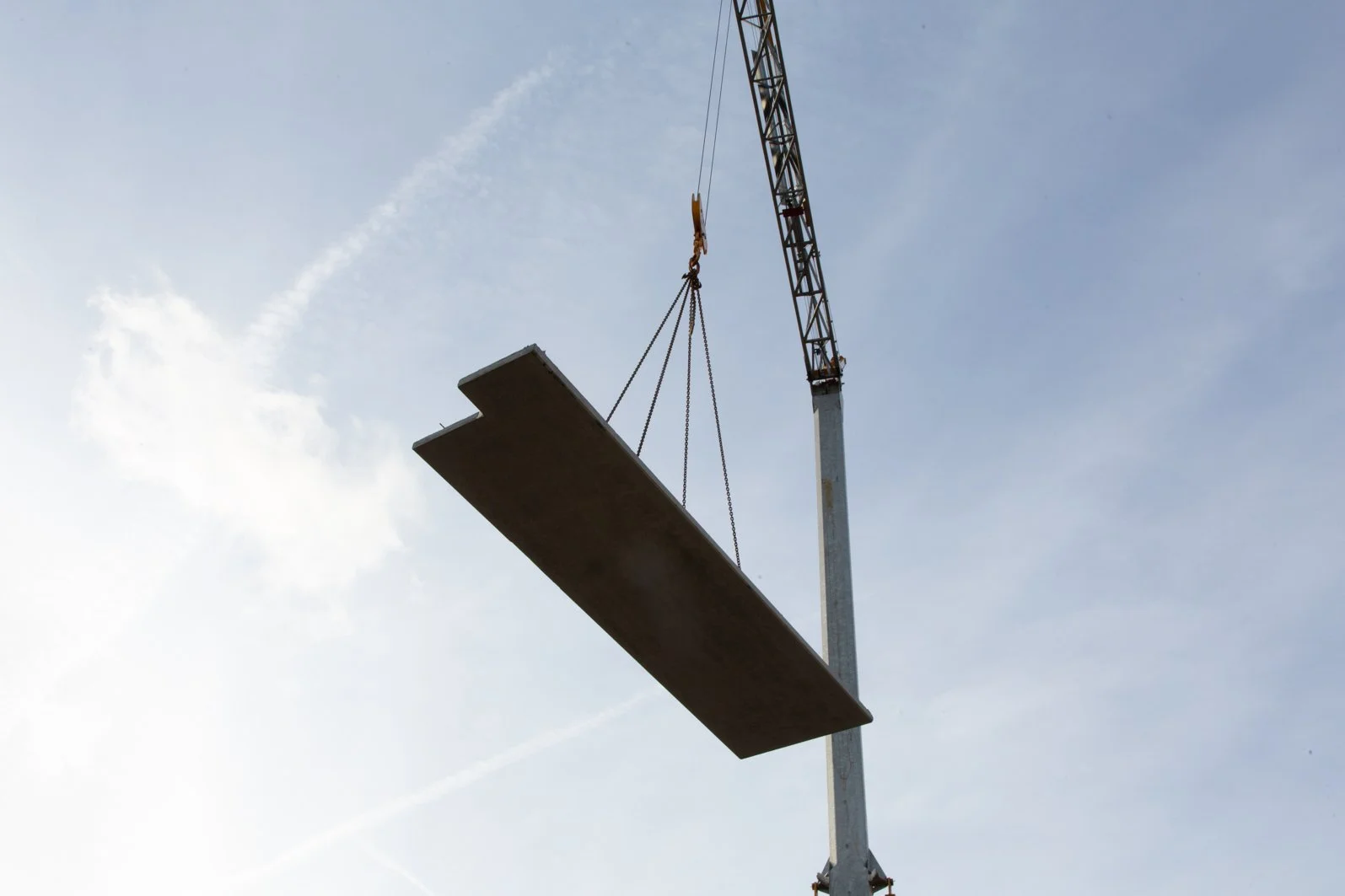 Crane lifting heavy cement plate