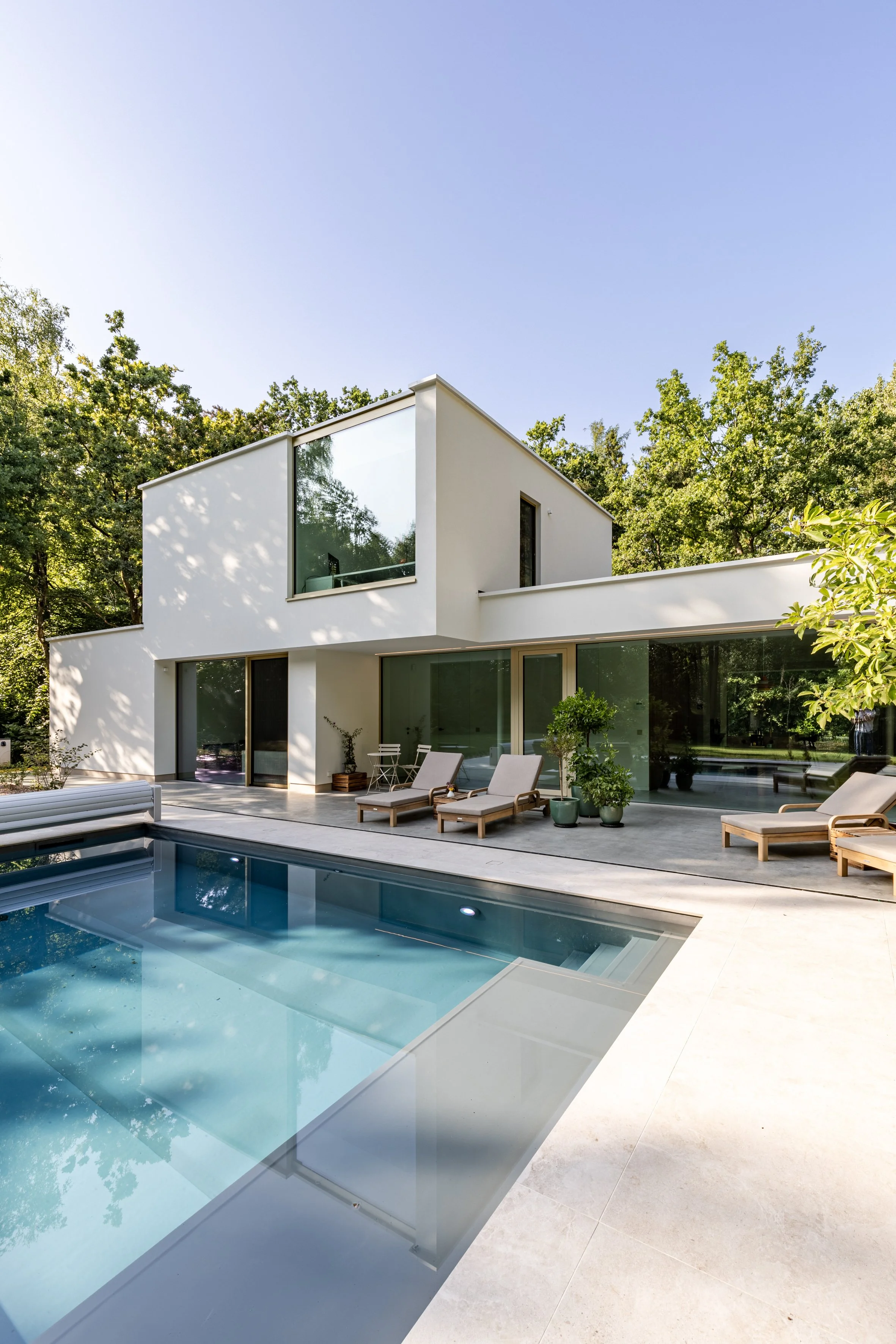 House with pool within nature
