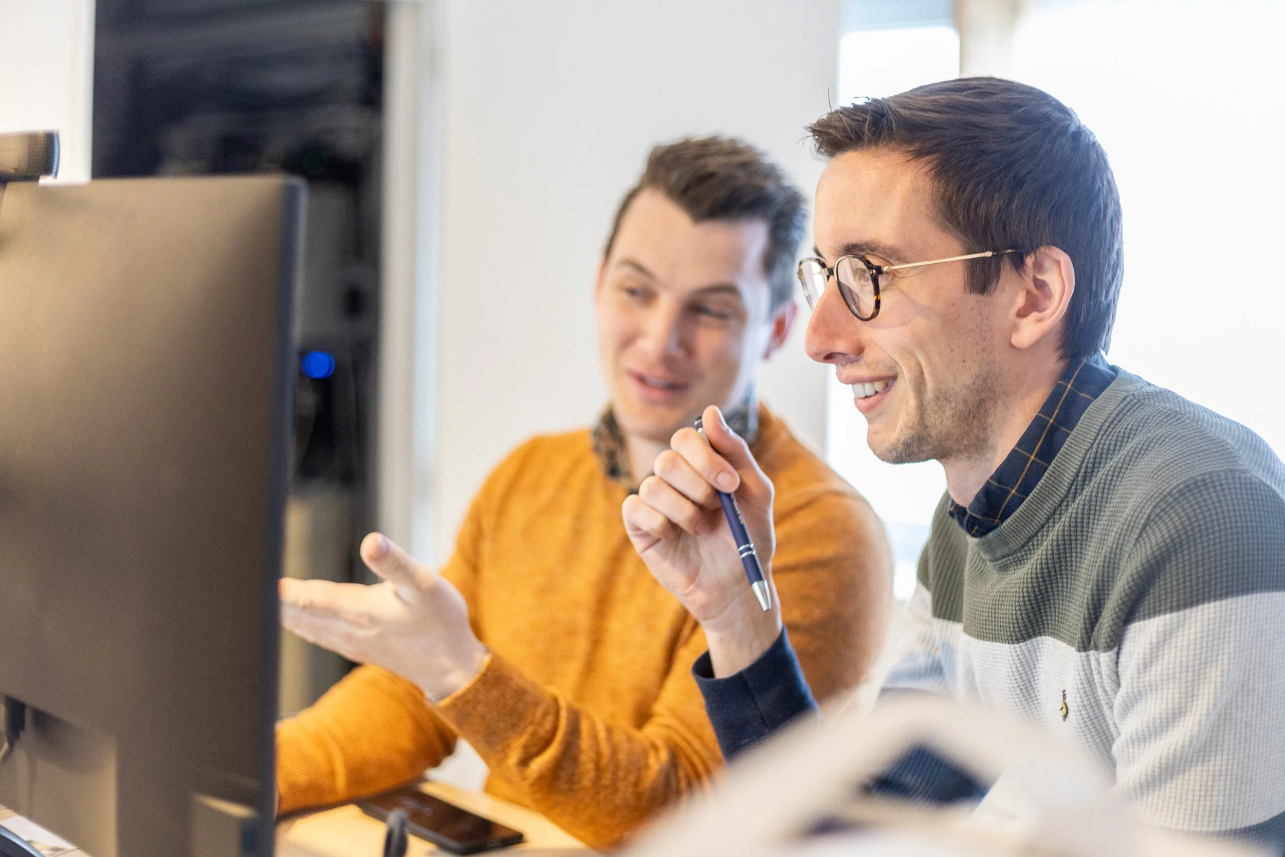 Two team members discussing a solution