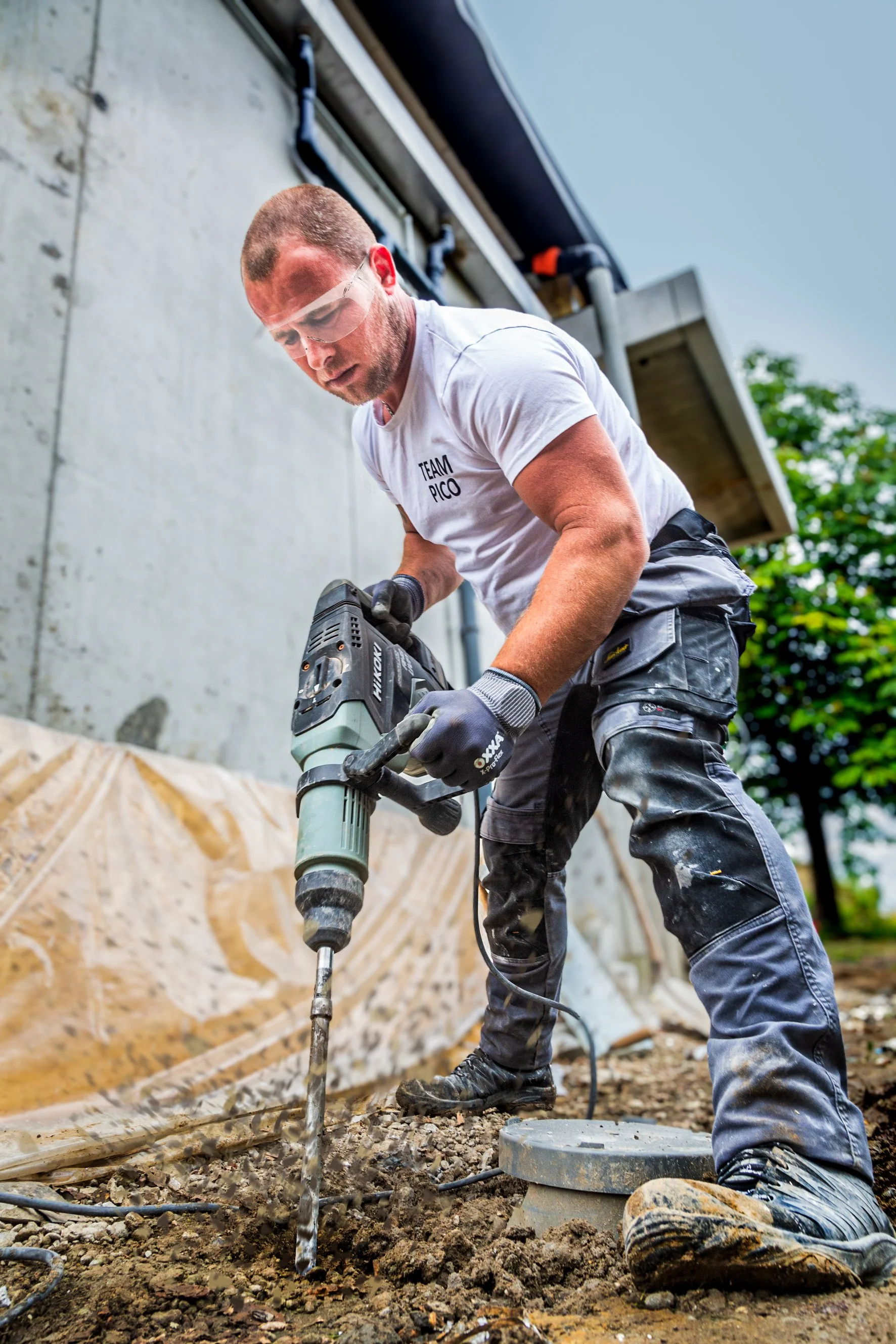 Construction worker digging a hole