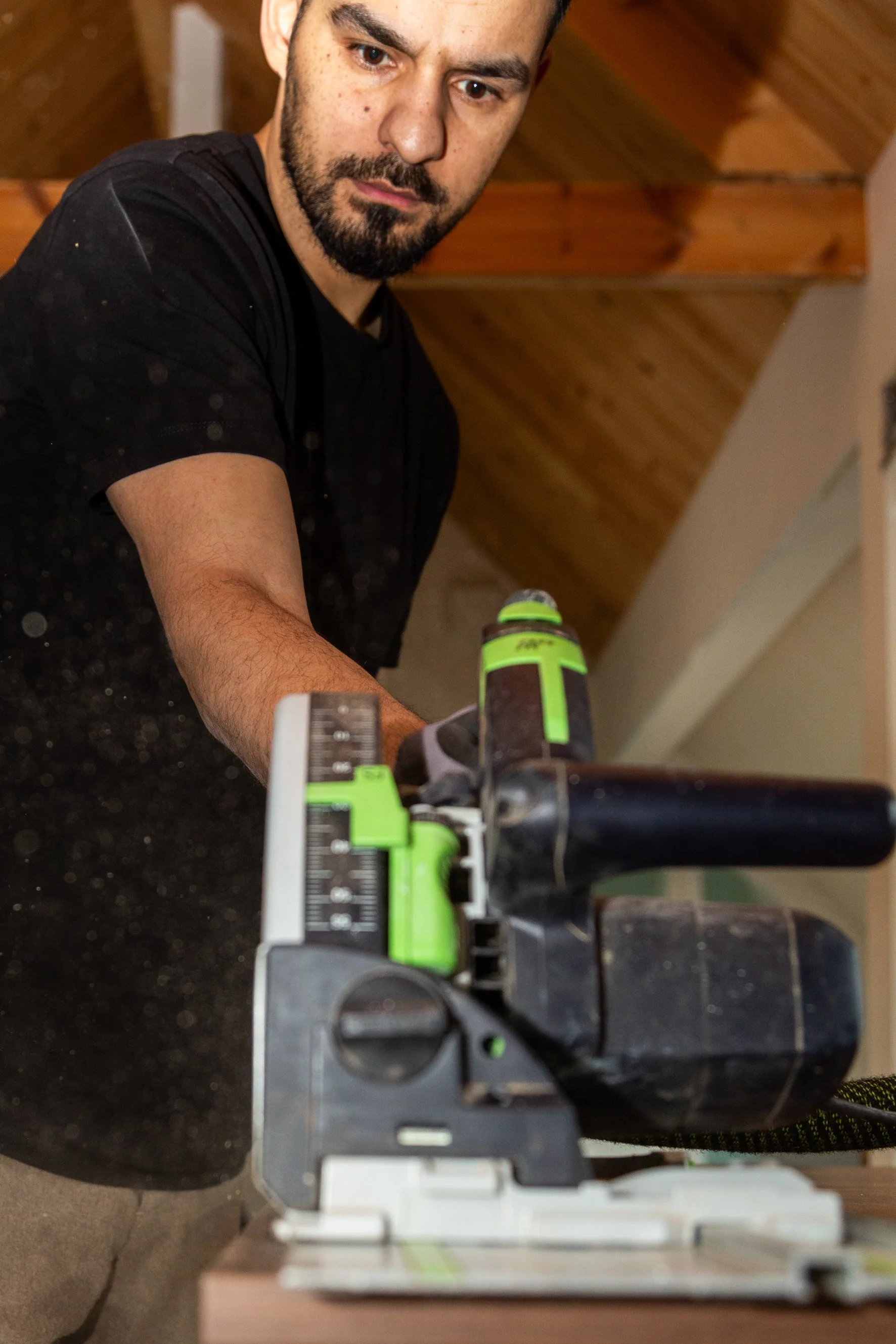Construction working cutting wood