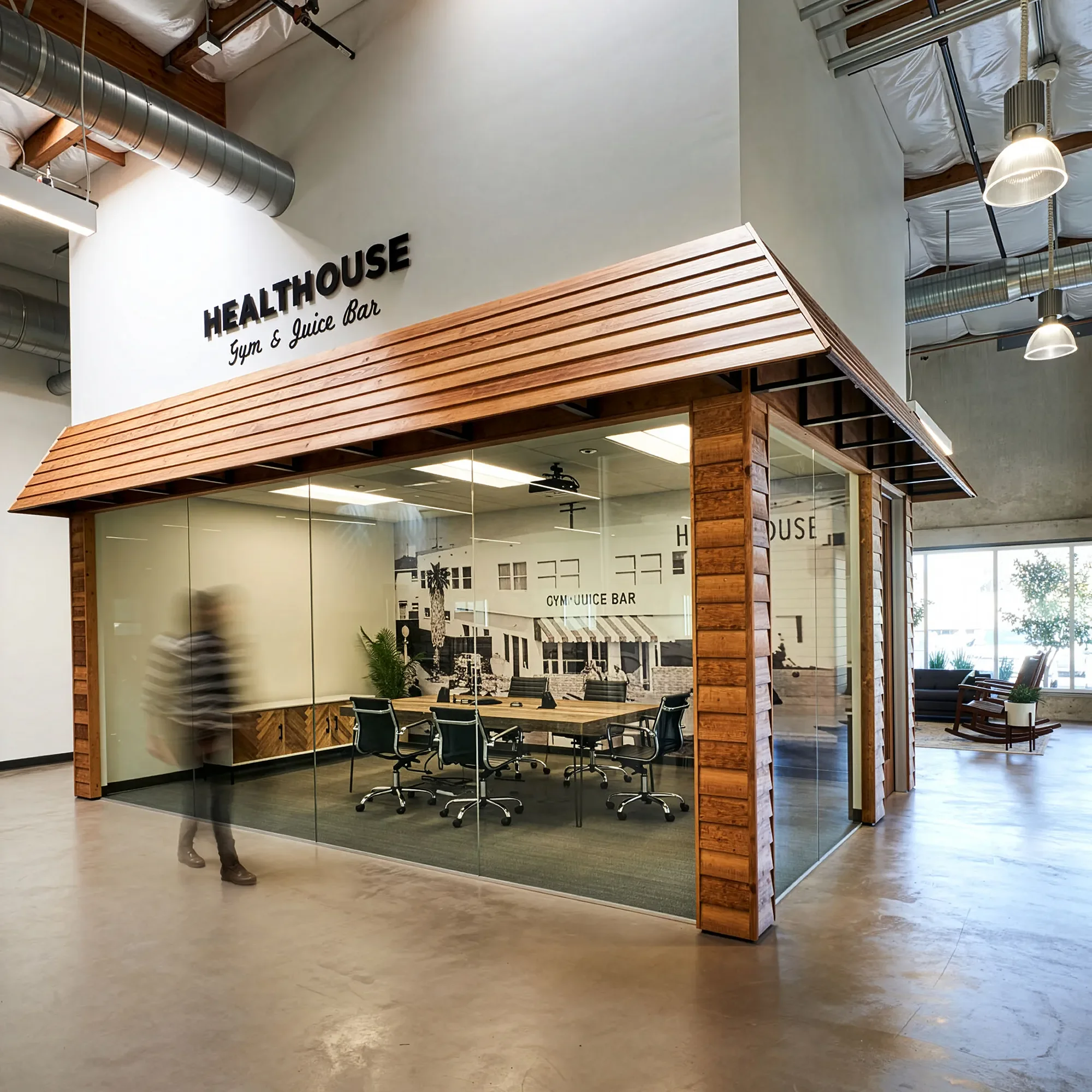 Timber clad portal framing a glass walled conference room in a San Diego office interior
