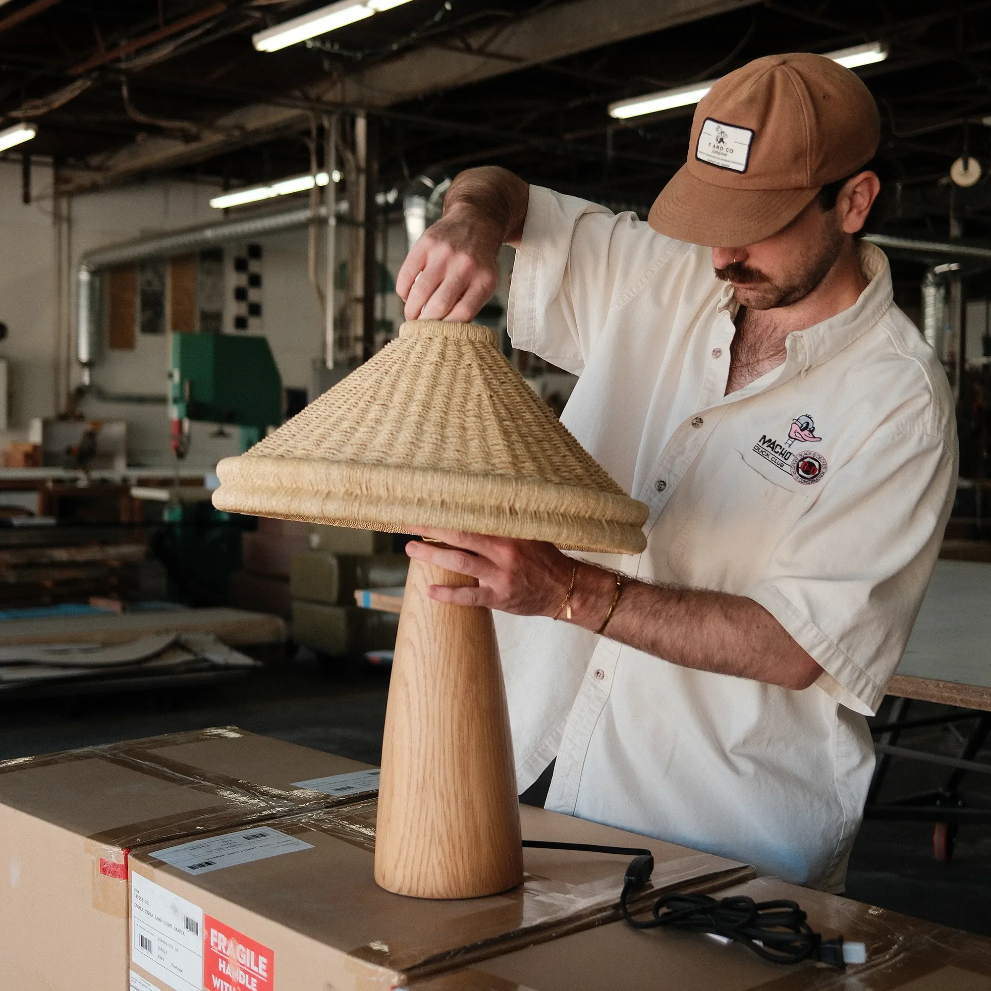 Woven rattan pendant shade inspected during furniture sourcing and quality control