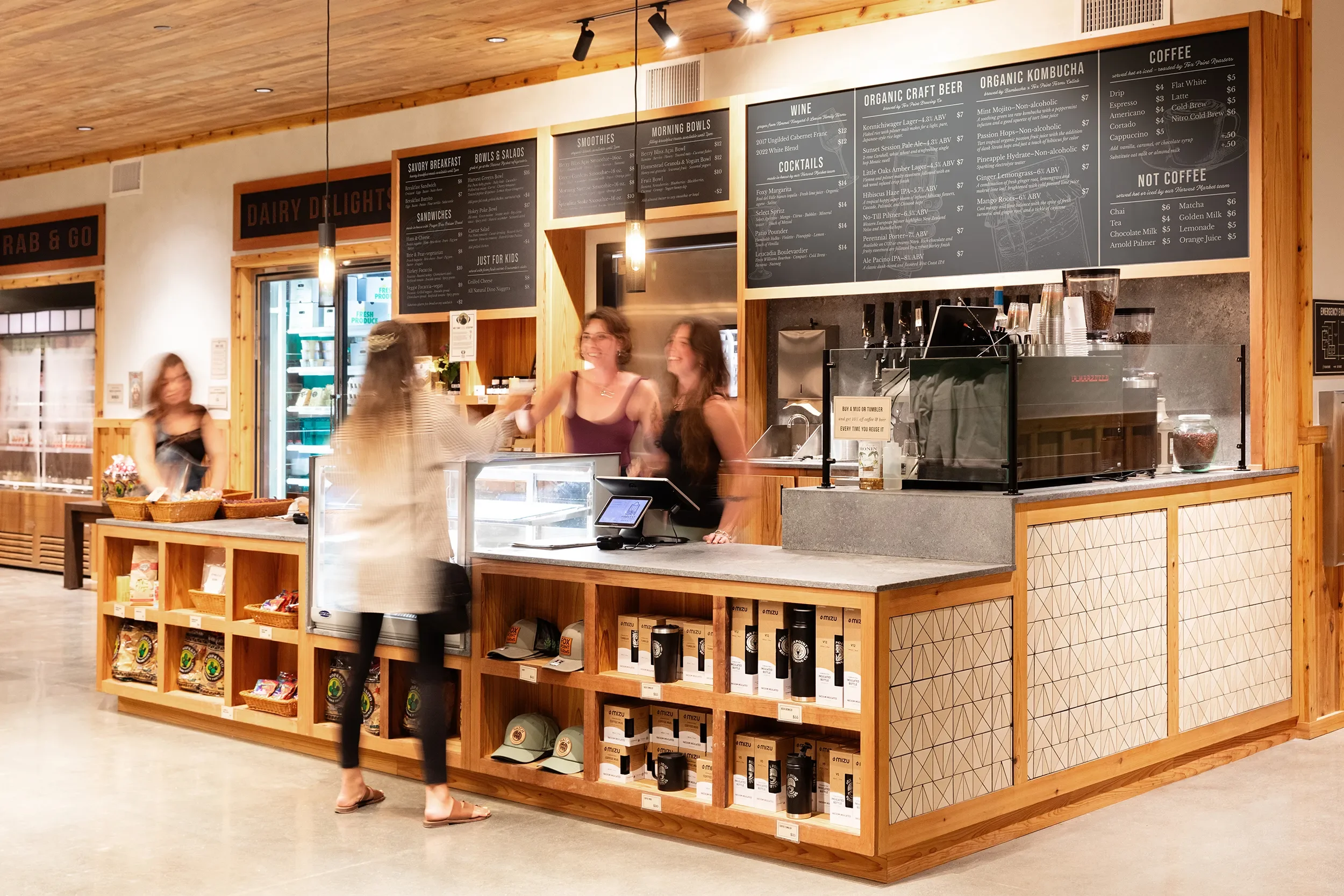 White oak service counter and chalkboard menu boards at the Fox Point Farms market in Encinitas