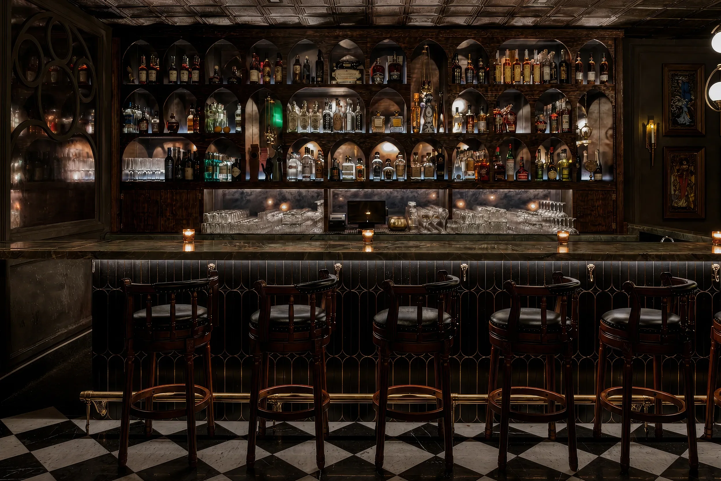 Dark wooden back bar and stools in the speakeasy at Anigma in Encinitas