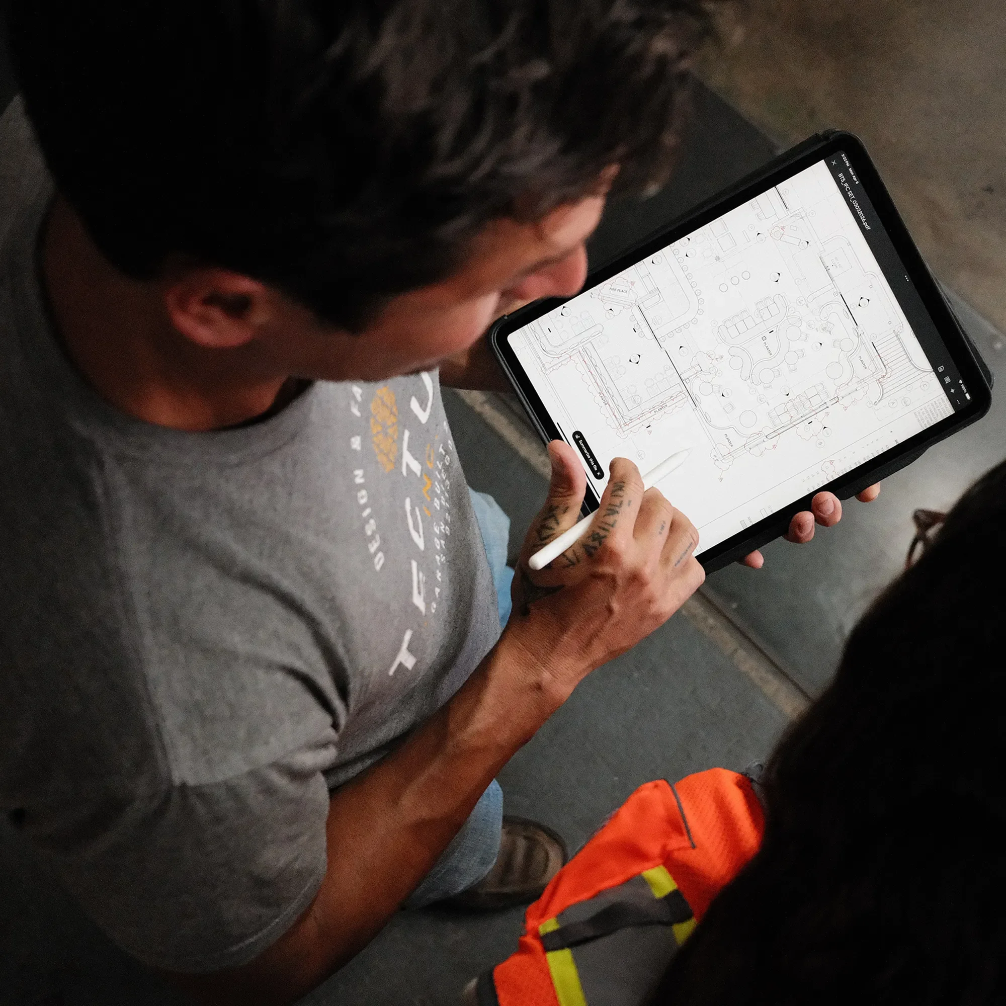 Marking up a plan  set on a tablet during construction administration