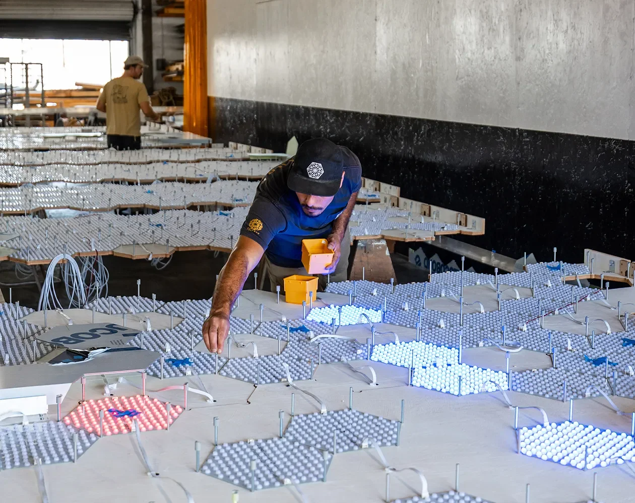 Tecture AF fabricator laying out integrated LED lighting components before assembly.