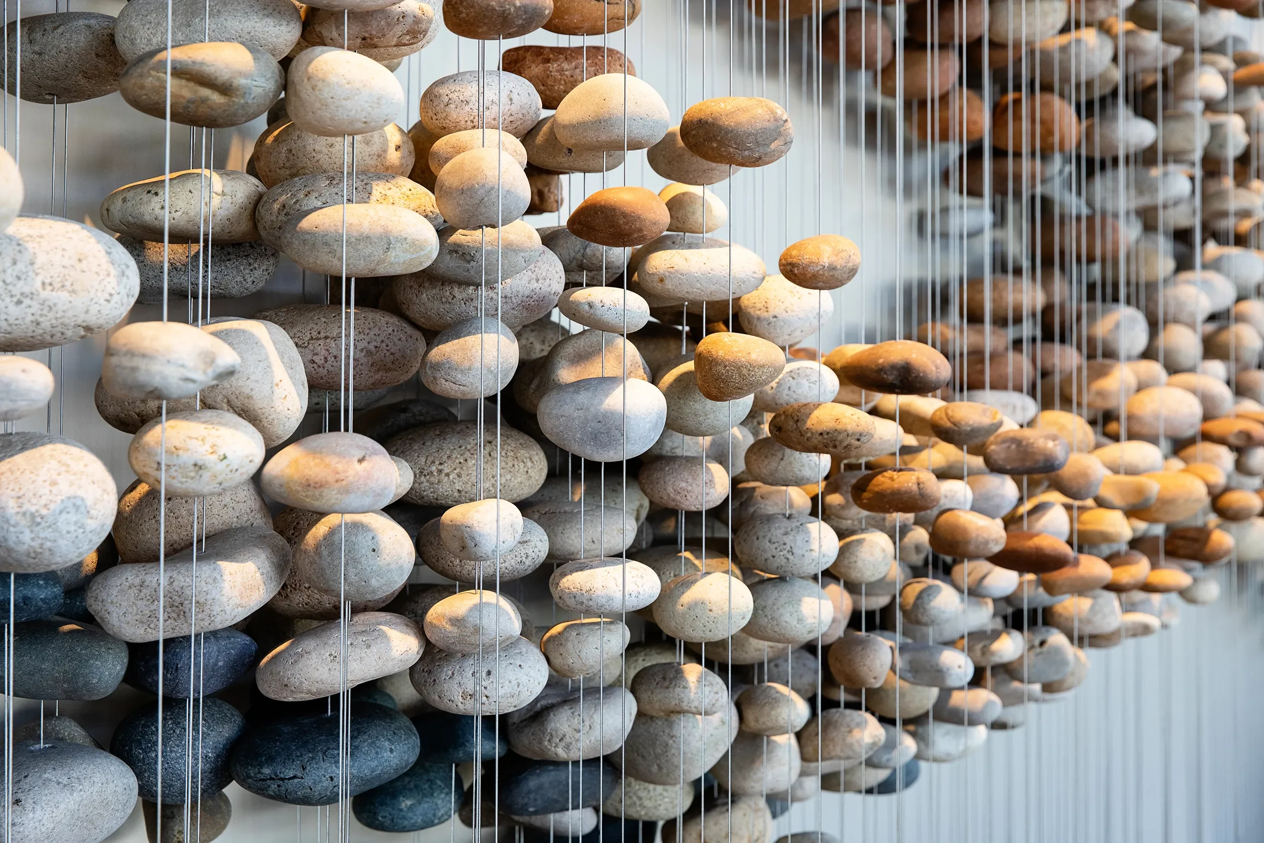 Detail of Stone Flock, beach stones suspended on individual cables in a schooling formation