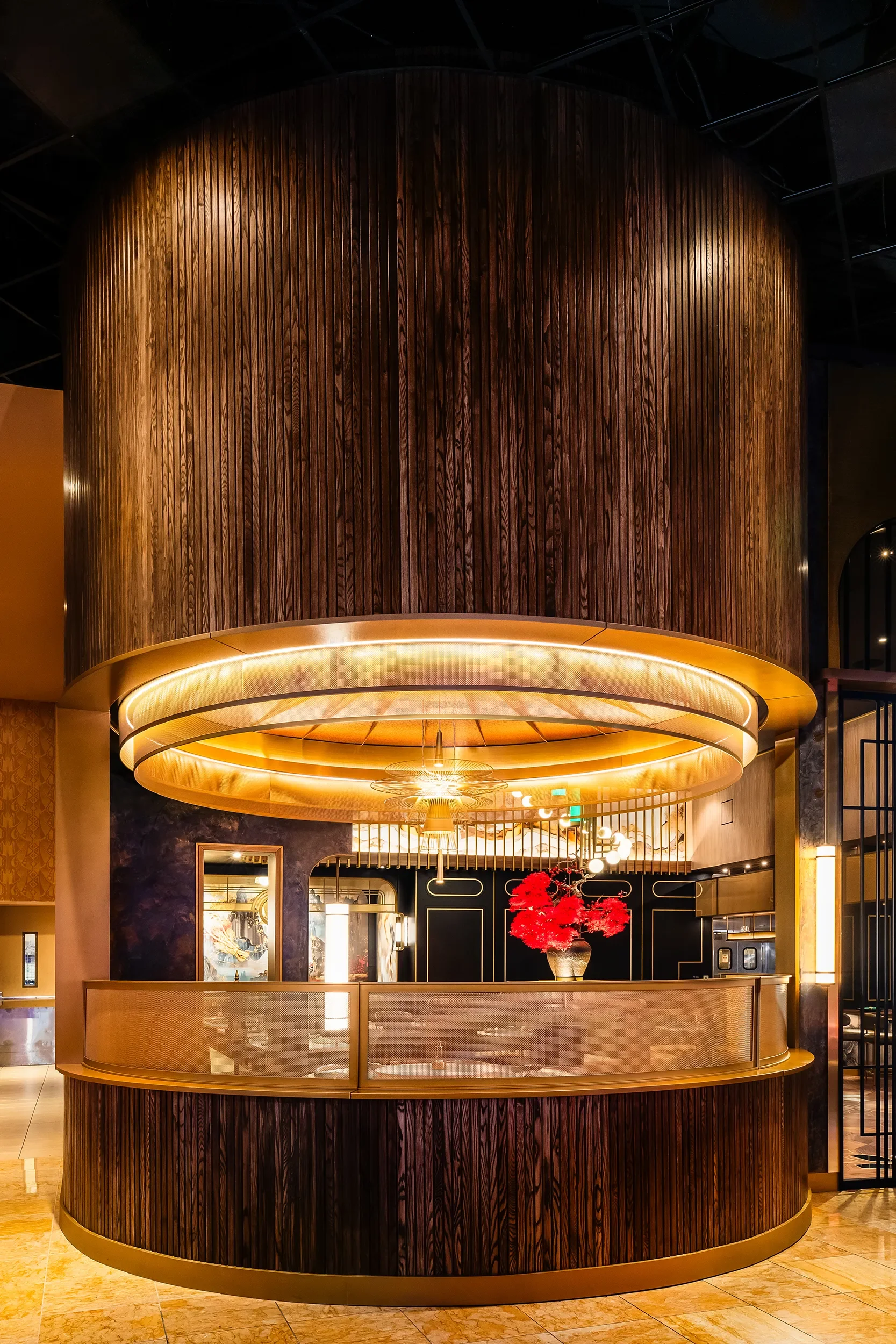 Curved wood slat drum wrapping a lit restaurant display at Enerald Casino in Jamul
