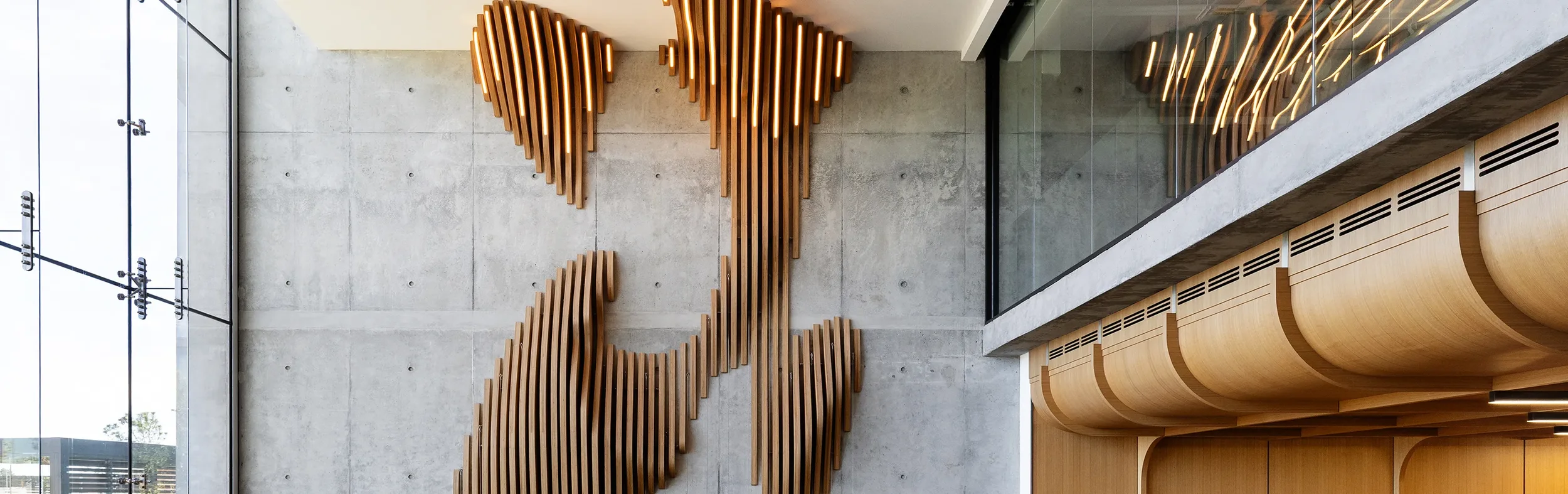 Parametric Wall sculptural wood feature wall in a corporate lobby.