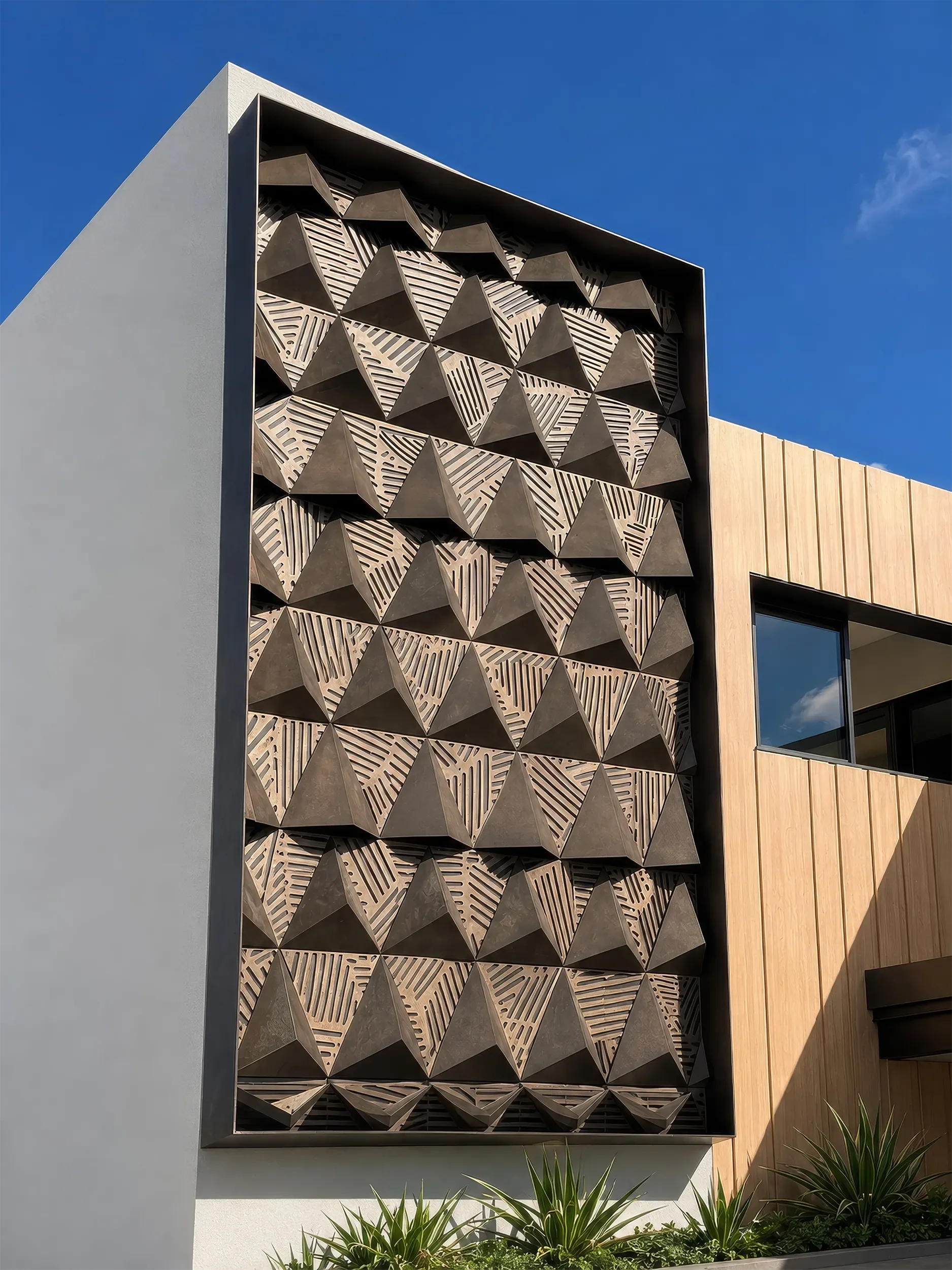 Facated metal screen panel mounted to a residential building exterior in Hawaii