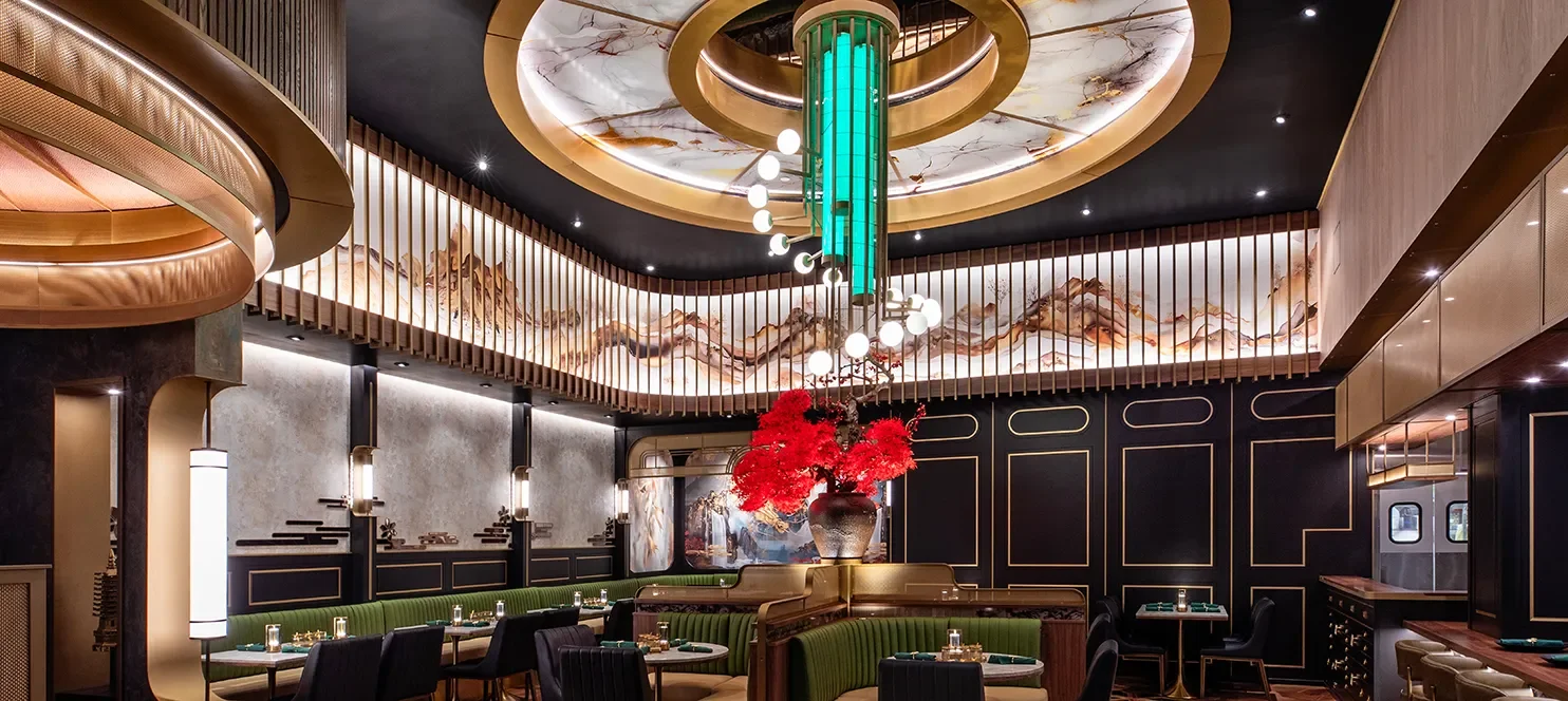 Custom sculptural ceiling chandelier above banquette and booth seating at Emerald Jamul Casino.