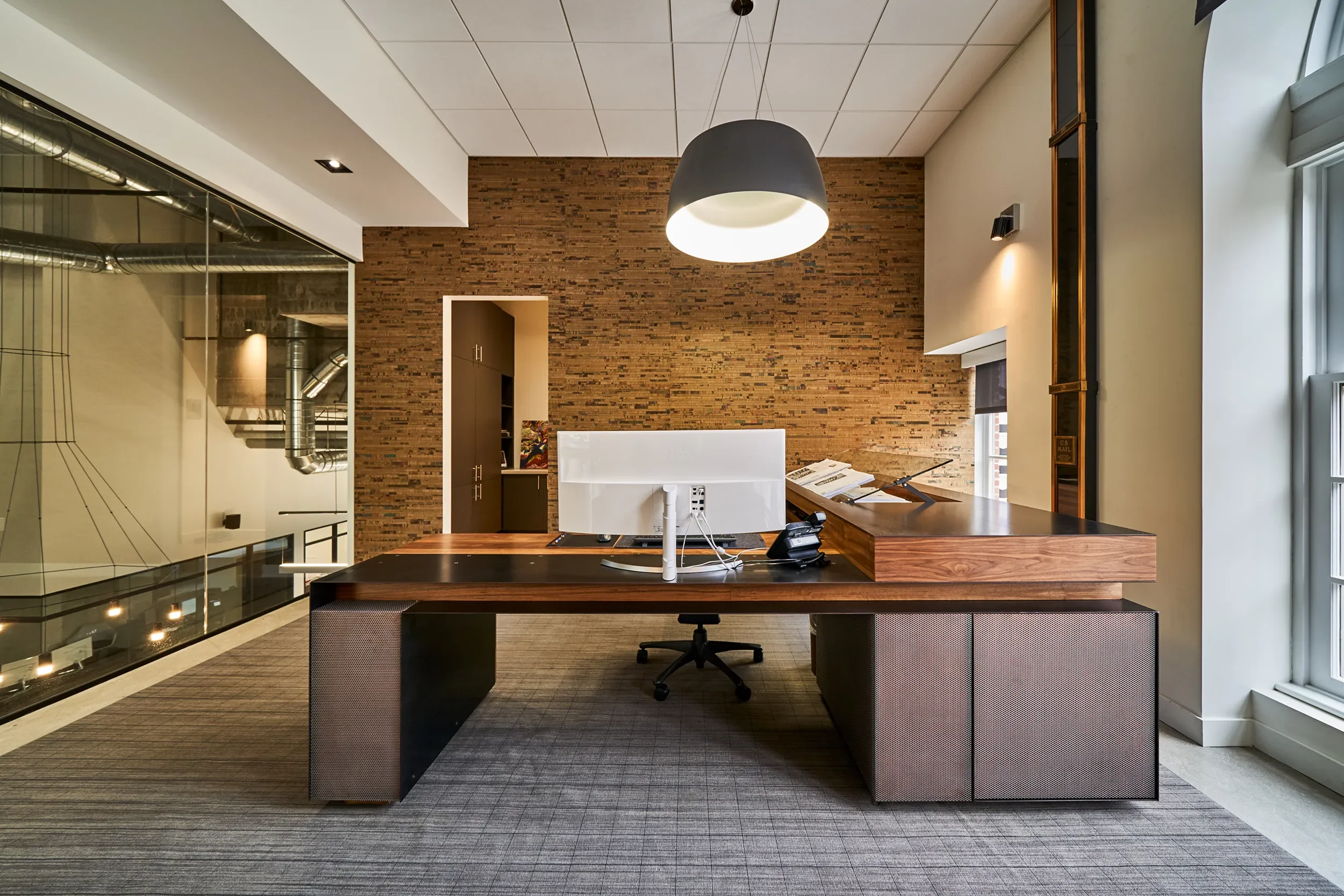 Custom walnut and steel executive desk at J Street Office in San Diego