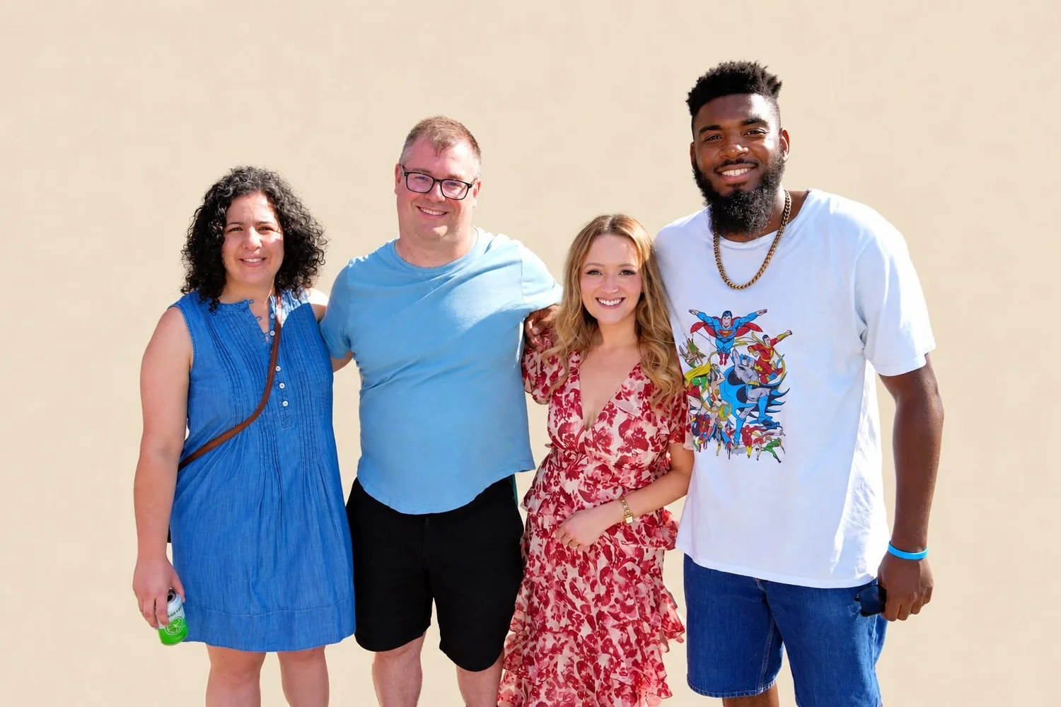 Kate with three members outdoors on a sunny day