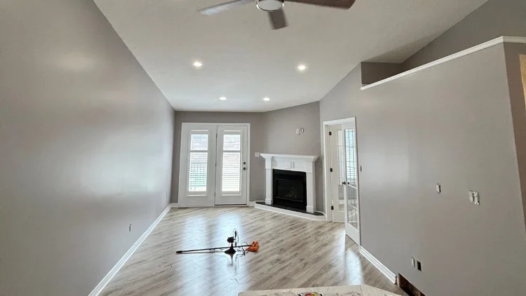 Bright living room freshly painted with crisp trim.