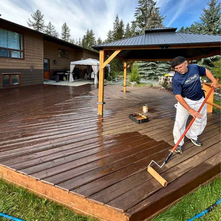 Rich timber deck protected with even stain coverage.