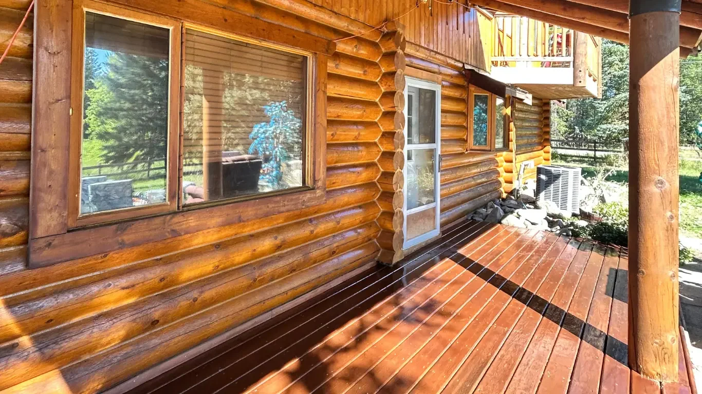 Evenly stained deck boards and sealed brick.