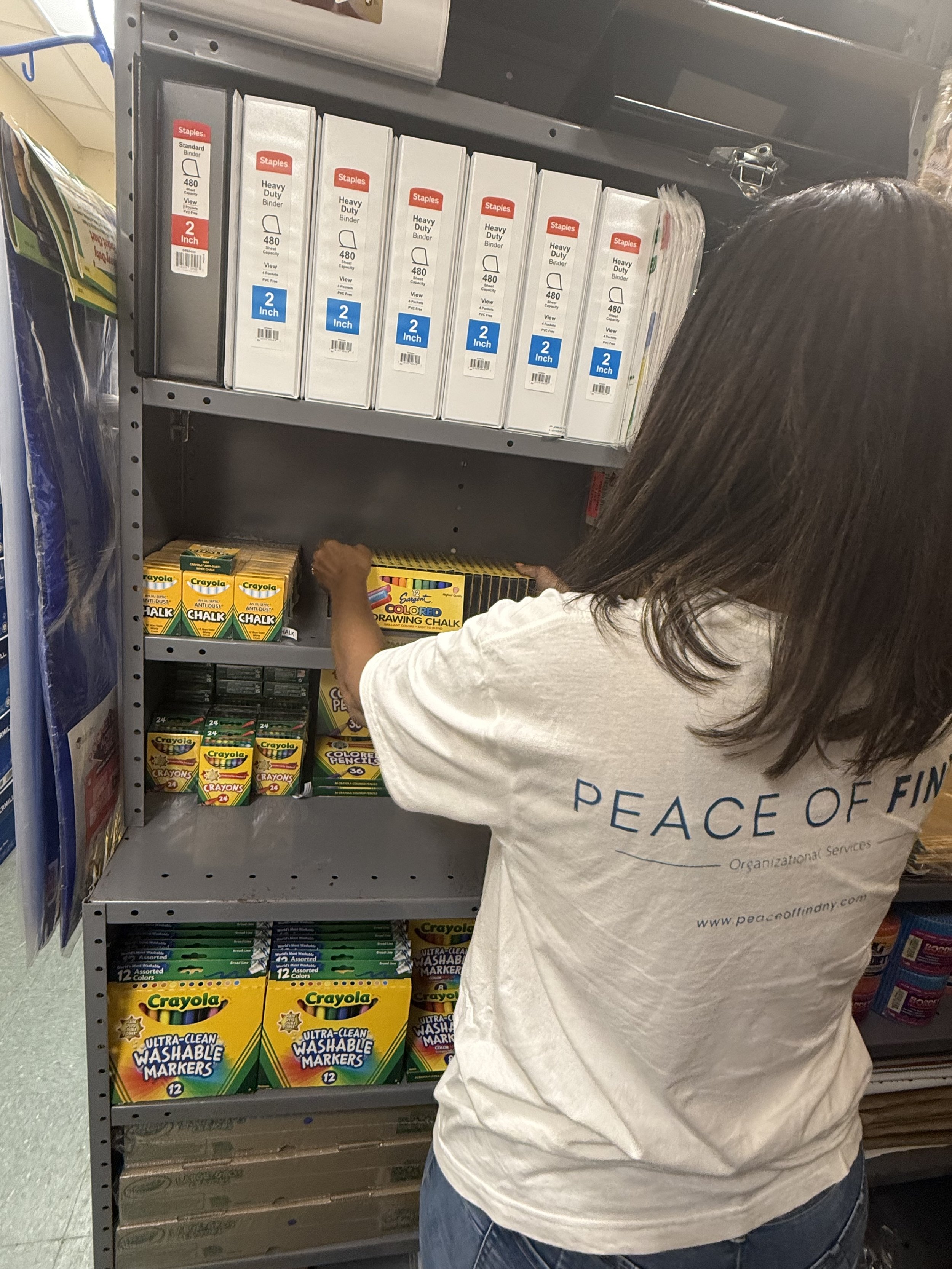 Worker organizing school supplies