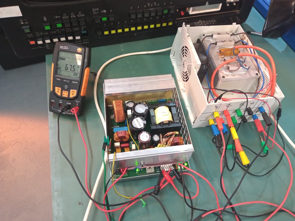 NPE engineer load-testing an industrial power supply unit on the bench in Newcastle workshop