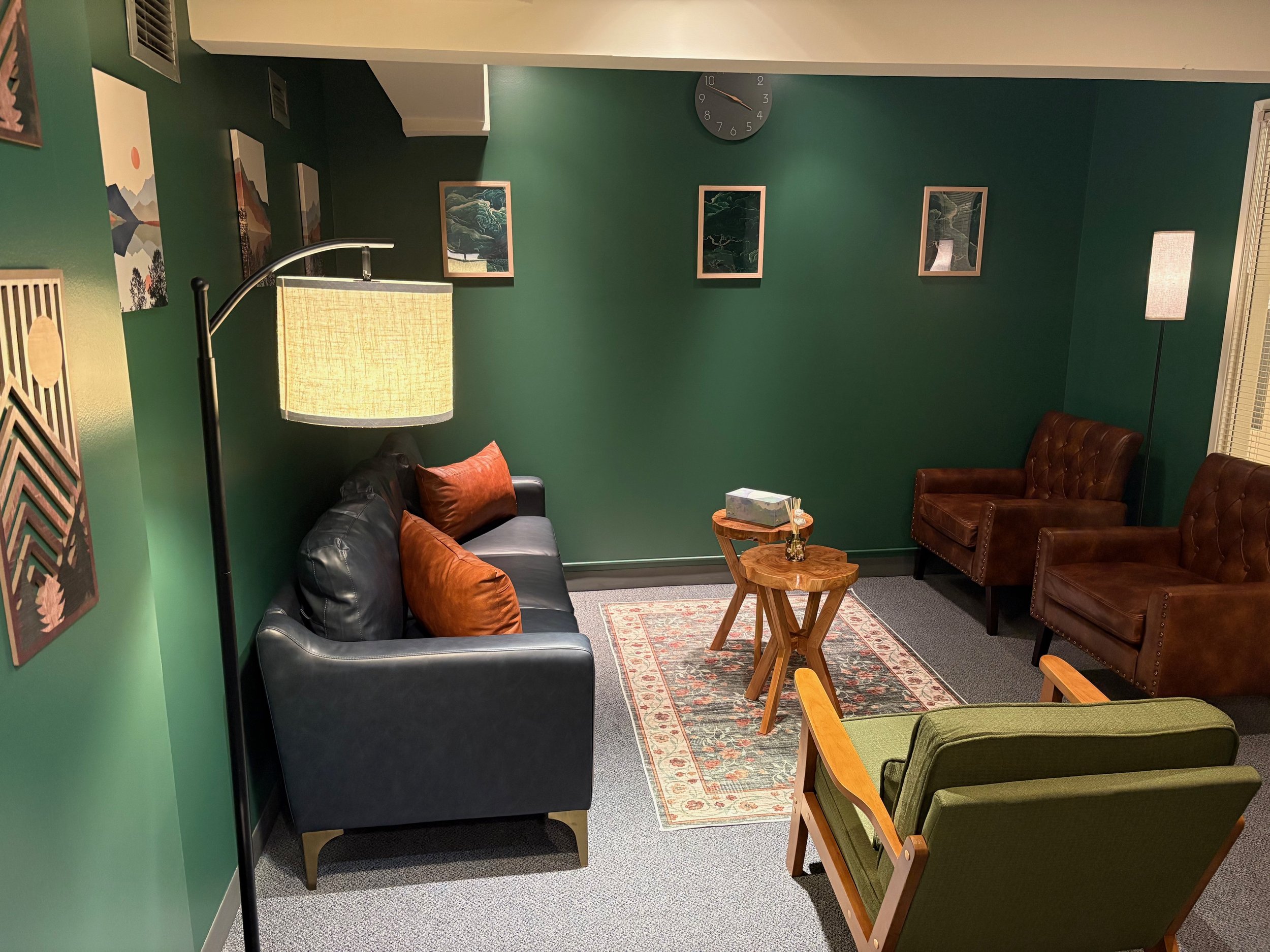 Humanistic Therapy NW Portland office interior — cozy chairs and artwork