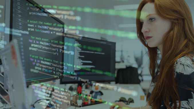 birdseye view of a handshake over a laptop and professional looking documents