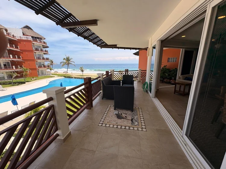 Corner balcony view of the beach and ocean beside the Laguna building from Unit 1223, Vivo Resorts