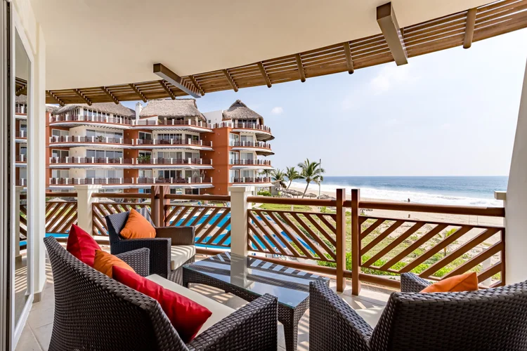 Balcony lounge looking toward the pool, Laguna building and ocean from Unit 1224 at Vivo Resorts