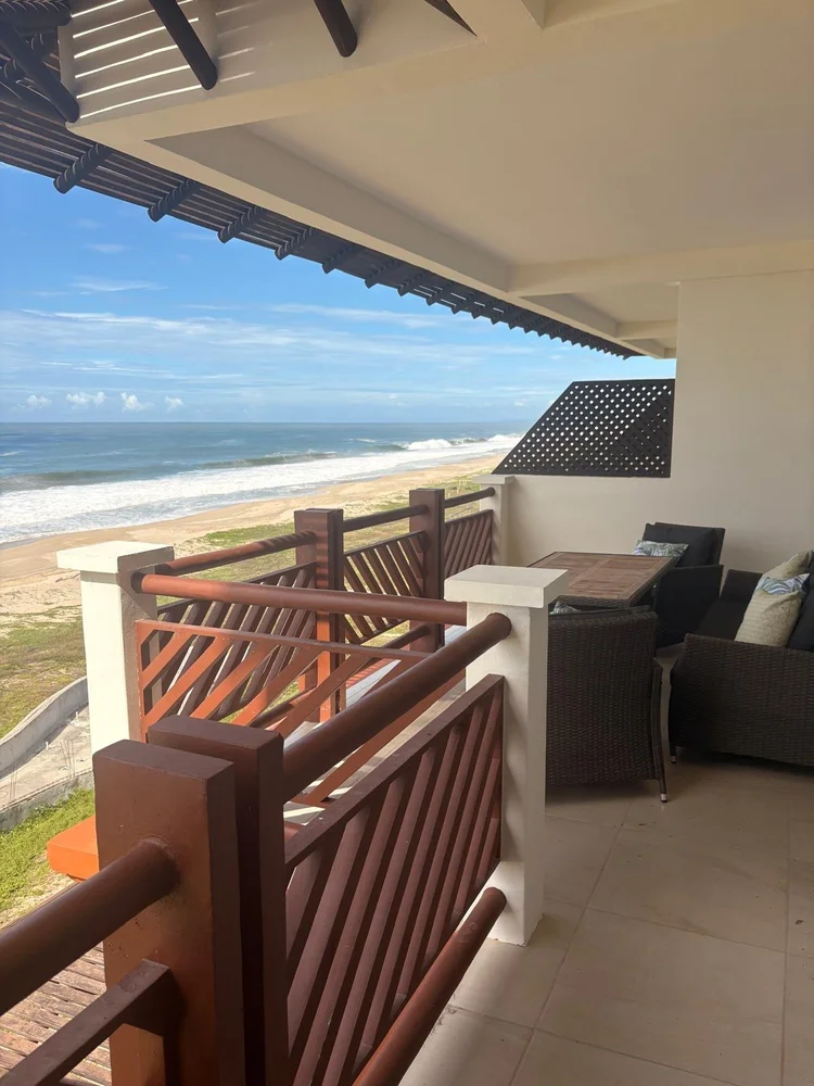 Covered balcony with ocean and beach views at Unit 1442, Nautico building, Vivo Resorts