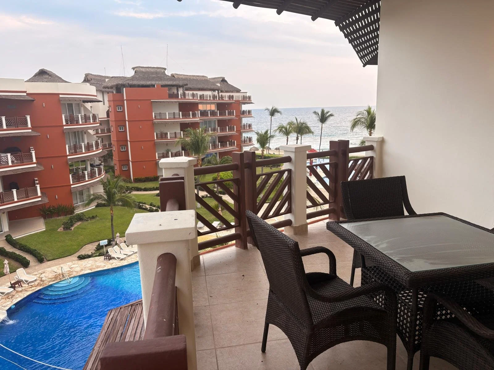 Unit 242, Vivo Resorts Building B: Furnished balcony with dining set and pool view